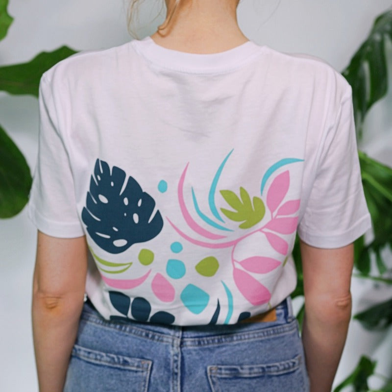 White 100% organic cotton t-shirt with foliage house plant design in pink blue and green
