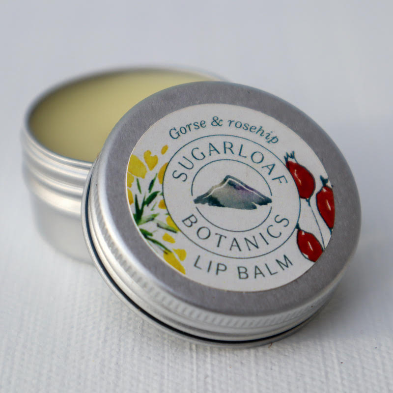 Foraged botanical ingredients in naturally made hand made skincare wellness gifts. Made in Ireland, in Wicklow. Beautiful, soft gorse and rosehip lip balm.